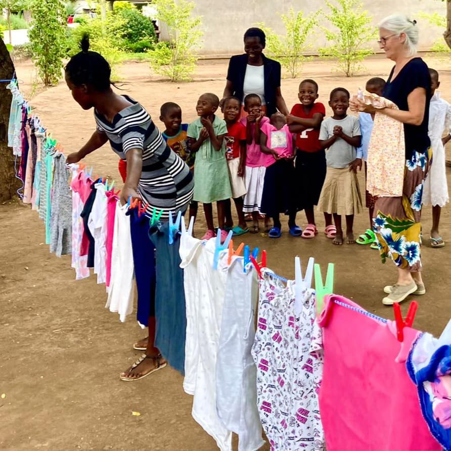 Donation Carousel Square ChildrenChoosingClothes